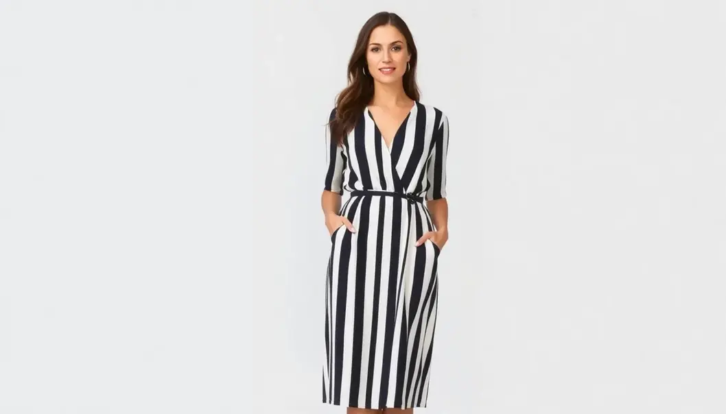 A vertically striped, high-waisted dress elongates the figure, perfect for petite frames.